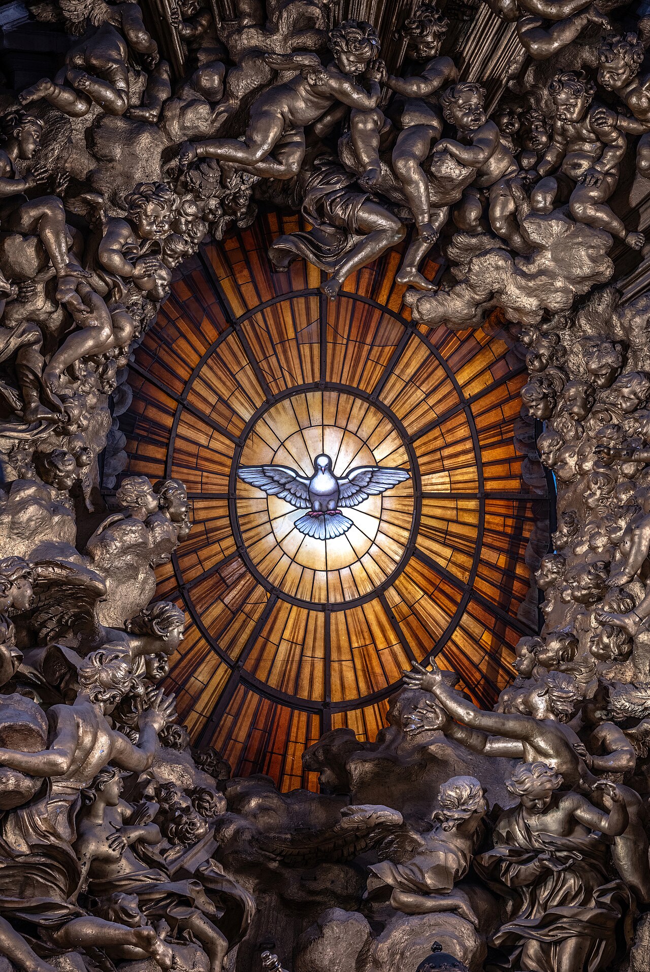 Bernini's radiant alabaster window of the Holy Spirit as a dove, golden light streaming out around it.